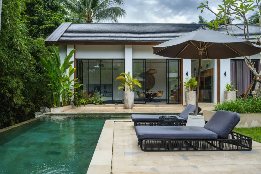 Private pool and terrace beside a modern tropical villa